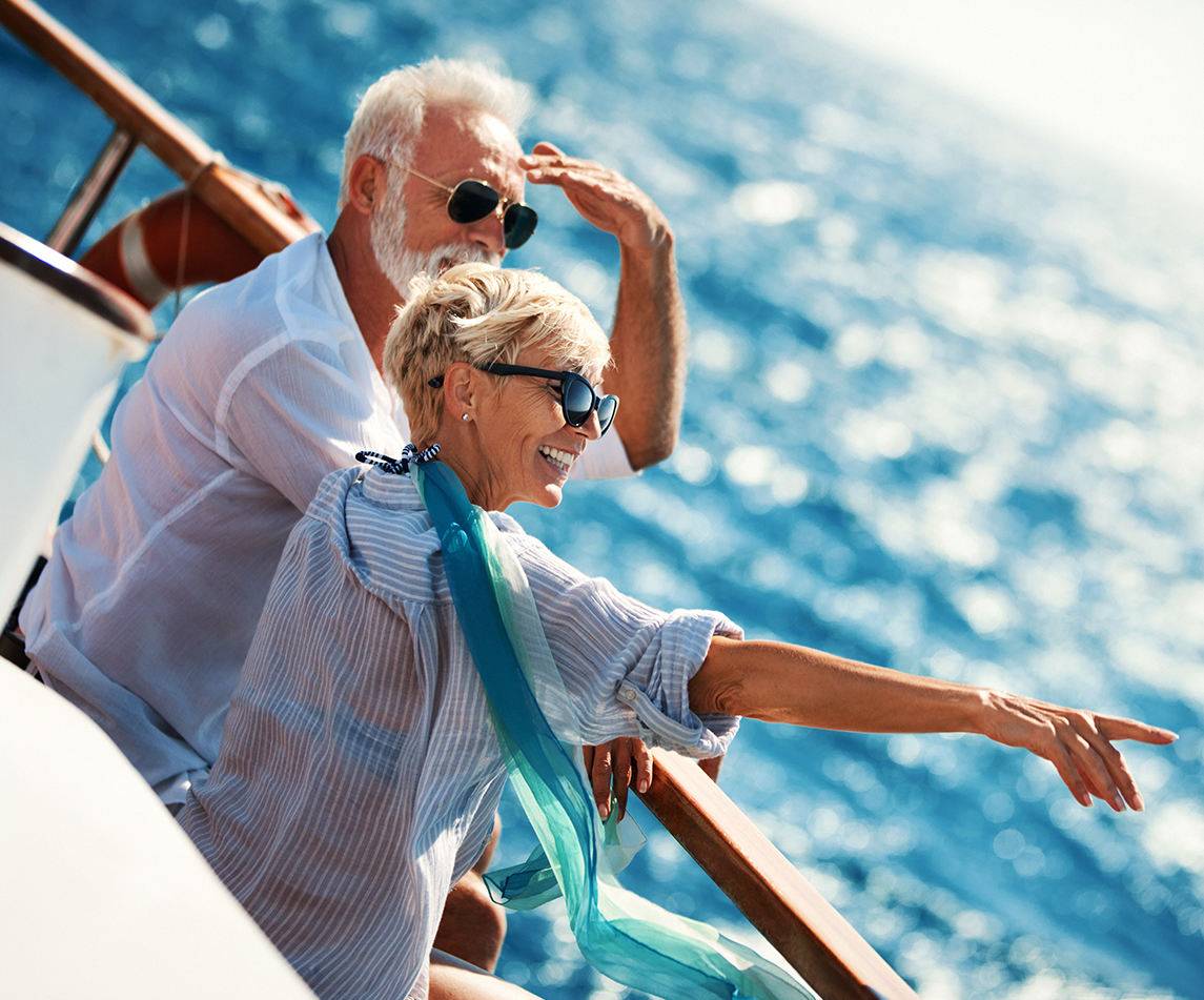Man and woman wearing prescription sunglasses while on a boat