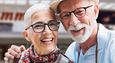 Elderly couple wearing glasses